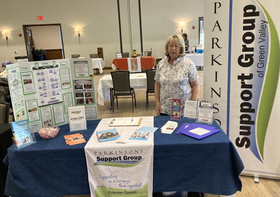 April 2026: Quail Creek's Health Fair. Carol M. standing with our Parkinson's Support Group Display